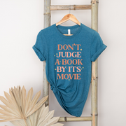 Don't Judge a Book By Its Movie Unisex T-shirt